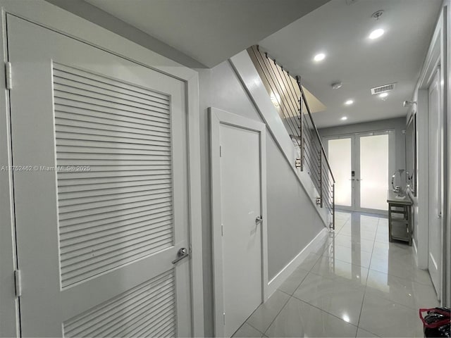 corridor featuring recessed lighting, visible vents, baseboards, stairs, and french doors