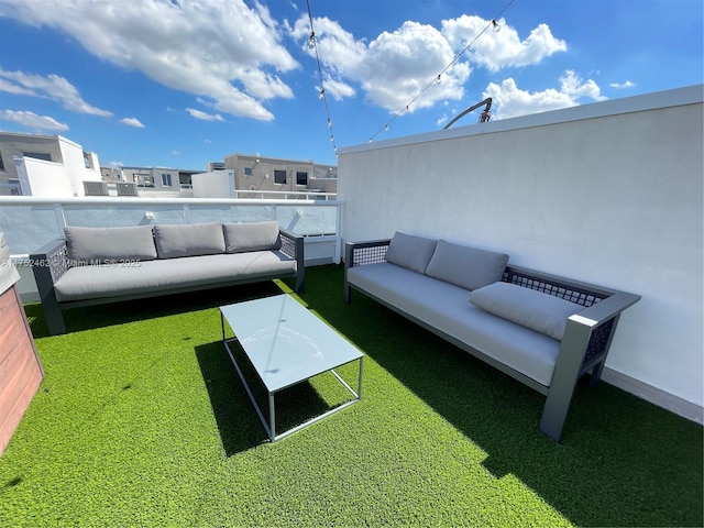 exterior space with outdoor lounge area and a balcony