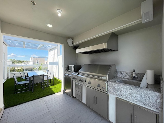 6651 NW 105th Pl Unit 6651, Doral, FL 33178 - view of patio with outdoor dining space and a sink