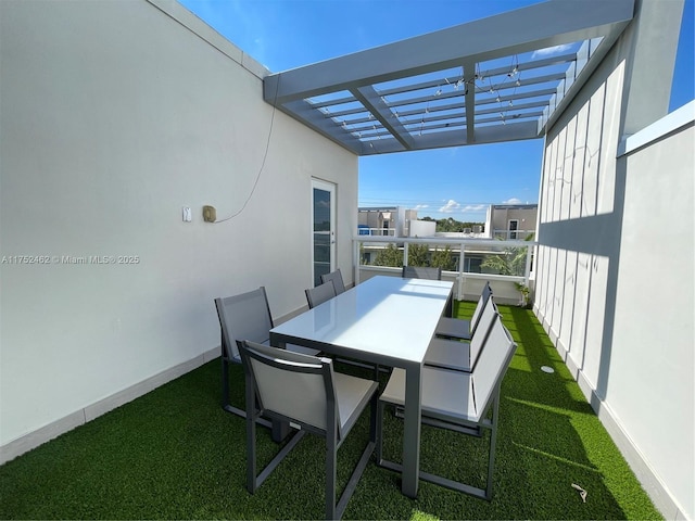 balcony with outdoor dining area and a pergola