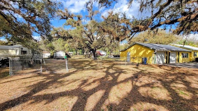 260 Fraser Ave, La Belle, FL 33935 - view of yard with a detached garage and fence
