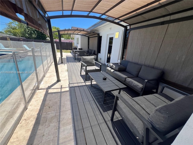 wooden terrace with a fenced in pool, fence, a patio area, an outdoor living space, and outdoor dining space