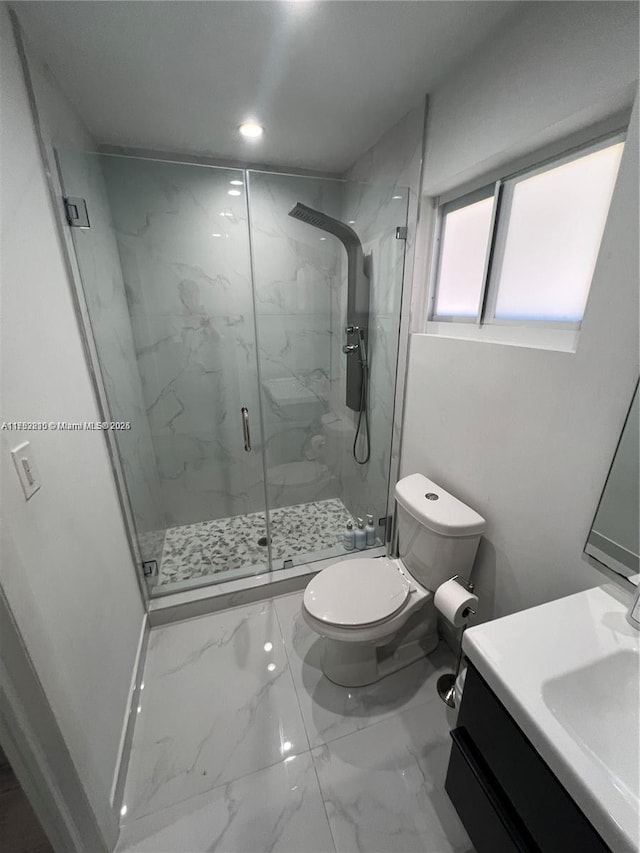 full bath with marble finish floor, toilet, vanity, and a marble finish shower