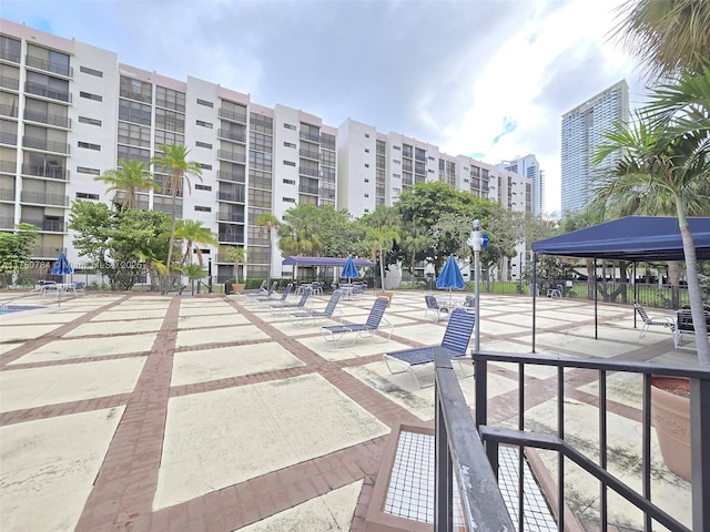 view of property's community featuring a view of city and a patio