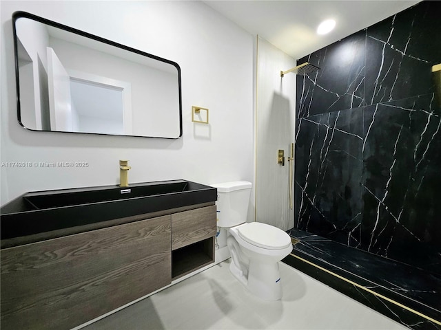 full bath with toilet, recessed lighting, a marble finish shower, and vanity