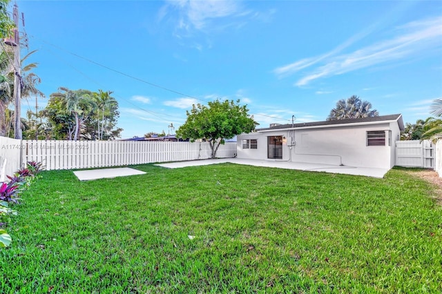 view of yard with a fenced backyard and a patio