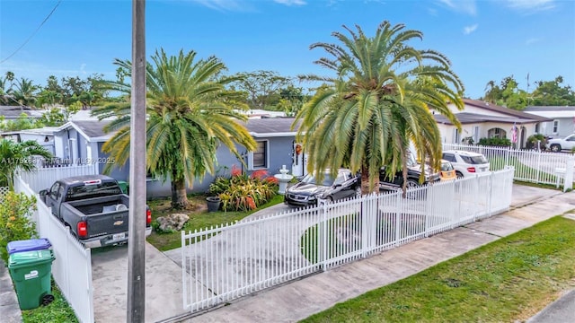 view of front facade featuring a fenced front yard and a residential view