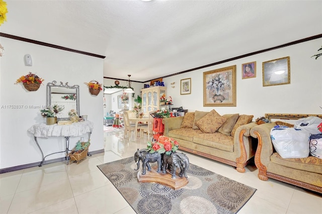 living room with crown molding, baseboards, and light tile patterned floors