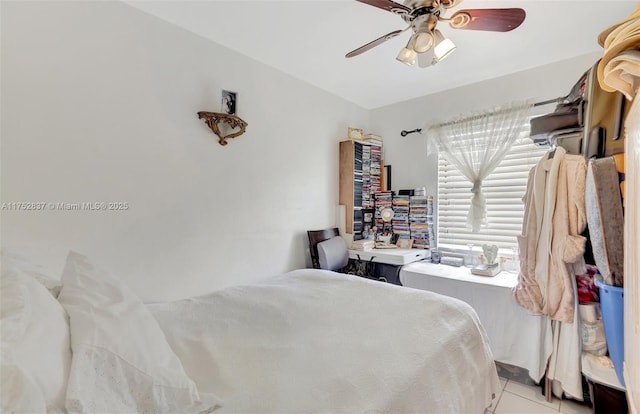 bedroom featuring a ceiling fan and light tile patterned flooring