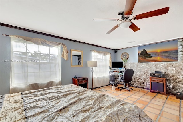 bedroom featuring light tile patterned floors, a ceiling fan, and crown molding