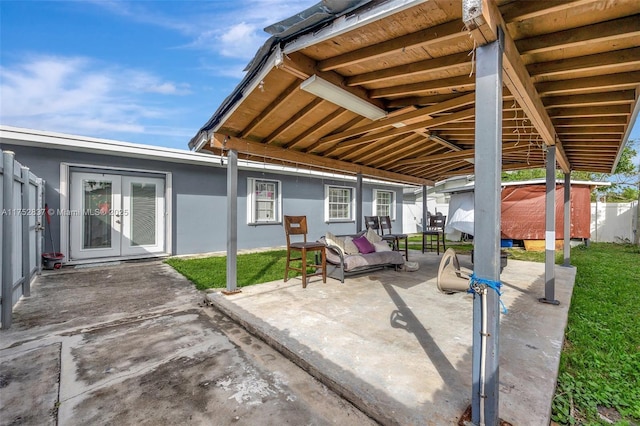 view of patio with fence and french doors