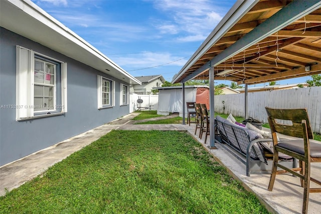 view of yard featuring a patio area and a fenced backyard