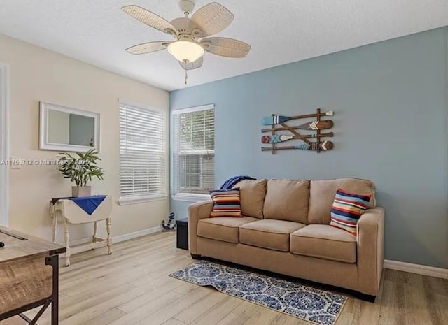 1860 Waterford Dr Unit 253, Vero Beach, FL 32966 - living area featuring a ceiling fan, baseboards, light wood-style floors, and a textured ceiling
