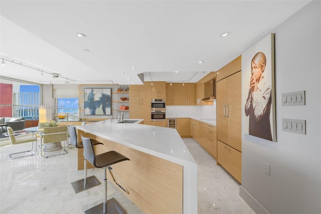 kitchen featuring electric cooktop, modern cabinets, and light countertops