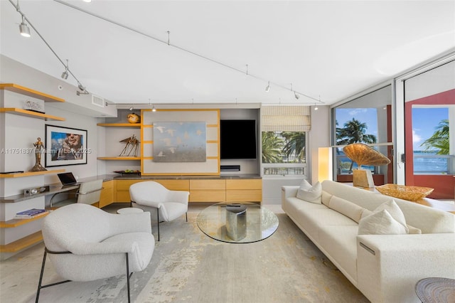 living room with visible vents and rail lighting