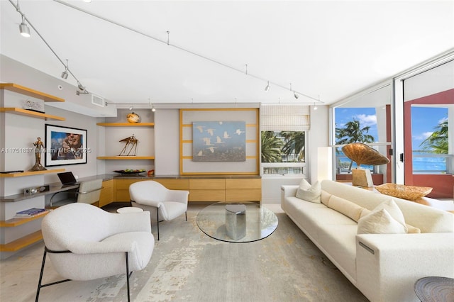 living room featuring visible vents and track lighting