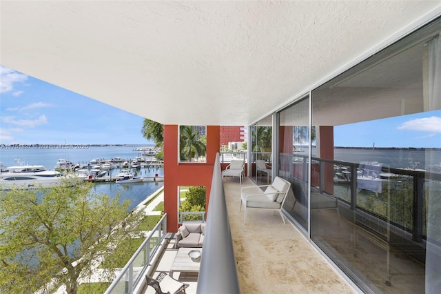 balcony featuring a water view