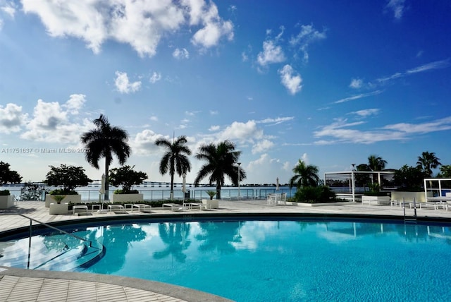 pool featuring a patio area and fence