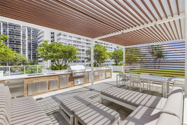 view of patio with area for grilling, a grill, an outdoor living space, a pergola, and outdoor dining space