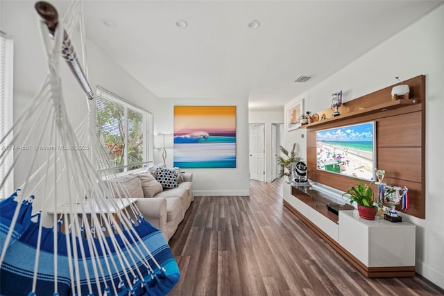5801 NE 3rd Ave, Oakland Park, FL 33334 - living area featuring visible vents, baseboards, and dark wood-type flooring