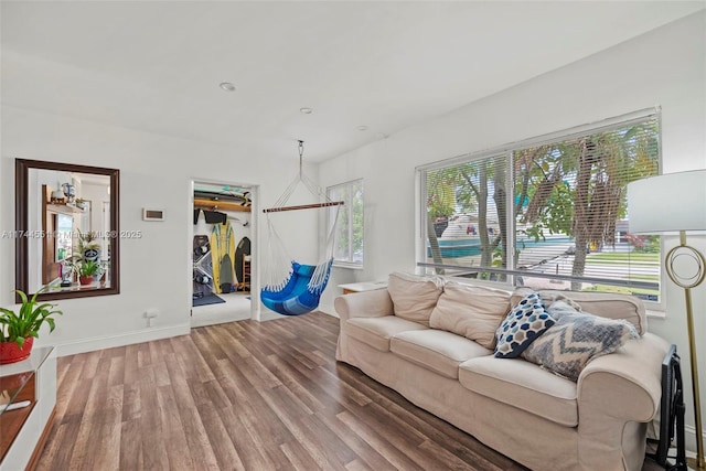 5801 NE 3rd Ave, Oakland Park, FL 33334 - living room featuring wood finished floors and baseboards