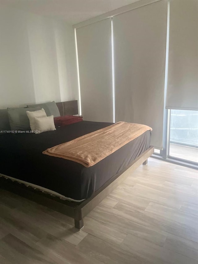 bedroom featuring a closet and wood finished floors