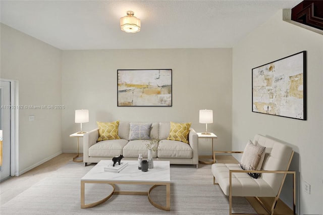 living room featuring baseboards