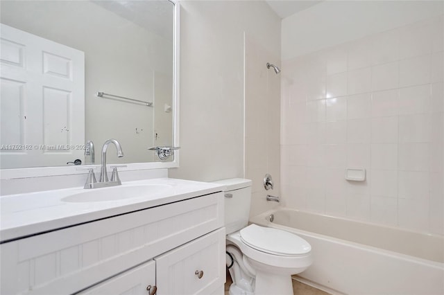 bathroom featuring  shower combination, vanity, and toilet