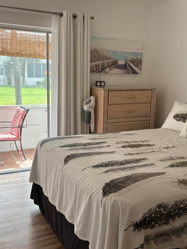 bedroom with wood finished floors