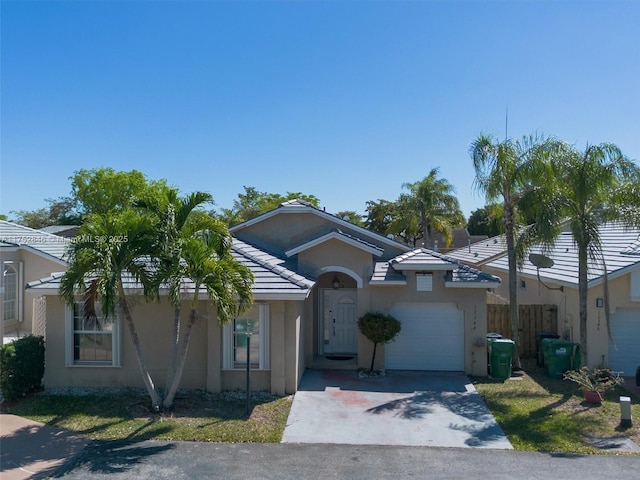 12344 SW 144th Ter, Miami, FL 33186 - single story home with a garage, stucco siding, driveway, and a tiled roof