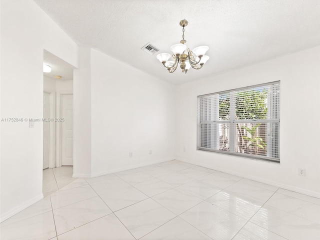 12344 SW 144th Ter, Miami, FL 33186 - unfurnished room featuring a chandelier, light tile patterned floors, baseboards, and a textured ceiling