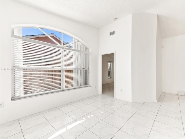 12344 SW 144th Ter, Miami, FL 33186 - empty room featuring a textured ceiling and a smoke detector