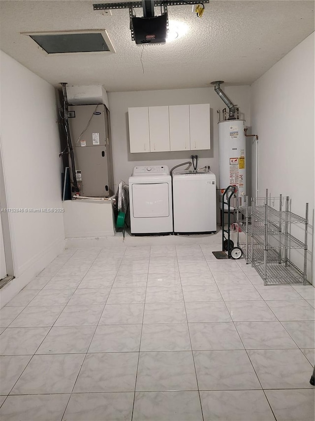 interior space with heating unit, water heater, a garage door opener, and independent washer and dryer