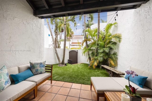 view of patio featuring a fenced backyard and outdoor lounge area