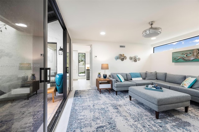 living room featuring visible vents and recessed lighting