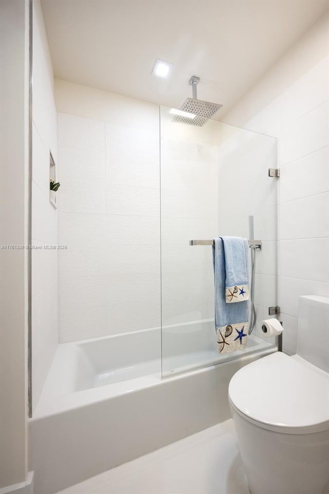 full bathroom featuring toilet and a combined bath / shower with rainfall shower