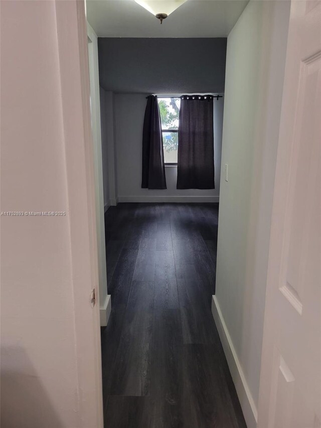 1470 NE 123rd St Unit A204, North Miami, FL 33161 - corridor with dark wood-type flooring and baseboards