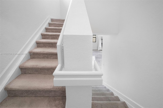 stairway with baseboards