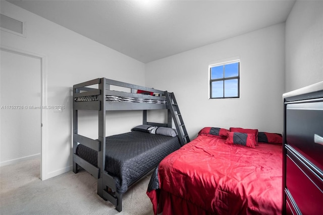 bedroom featuring baseboards, carpet flooring, and visible vents