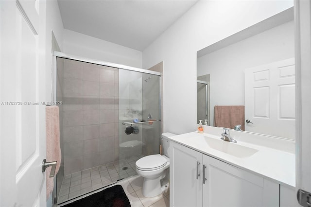 full bathroom featuring toilet, a stall shower, tile patterned flooring, and vanity