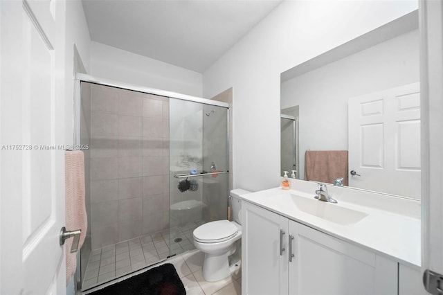 full bath with toilet, a shower stall, tile patterned flooring, and vanity
