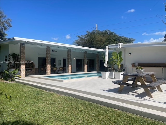 rear view of property with a wooden deck