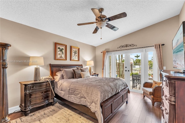 bedroom featuring access to exterior, lofted ceiling, french doors, and dark wood-style floors