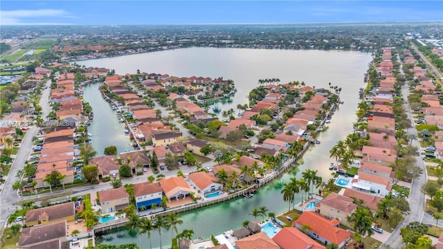 bird's eye view with a water view and a residential view