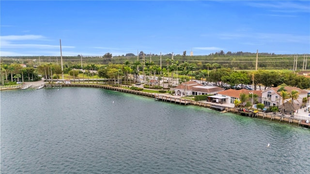 birds eye view of property featuring a water view and a residential view