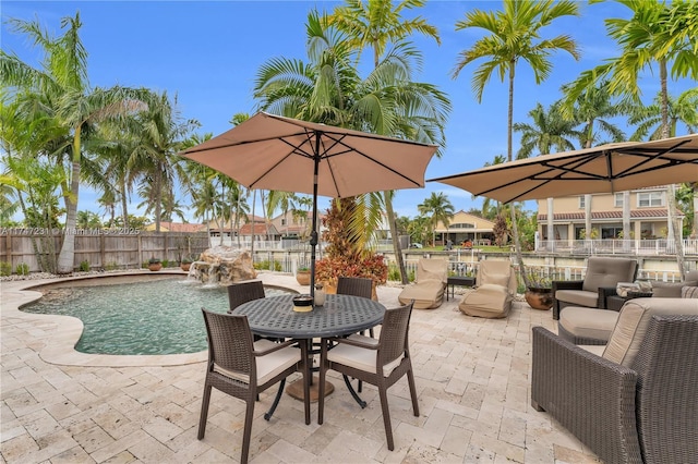 view of patio / terrace with fence and a fenced in pool