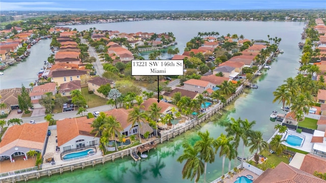 bird's eye view with a residential view and a water view