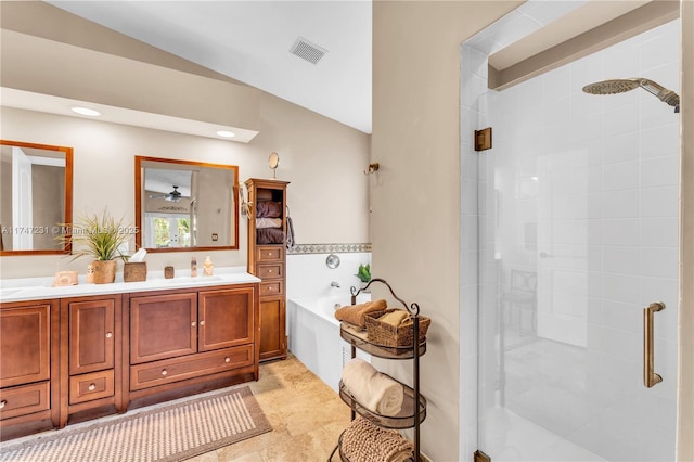 bathroom with double vanity, a stall shower, visible vents, a garden tub, and a sink