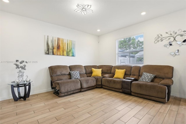 living area featuring light wood-style floors, recessed lighting, and baseboards