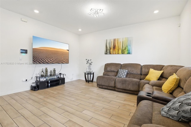 living room featuring recessed lighting and light wood finished floors